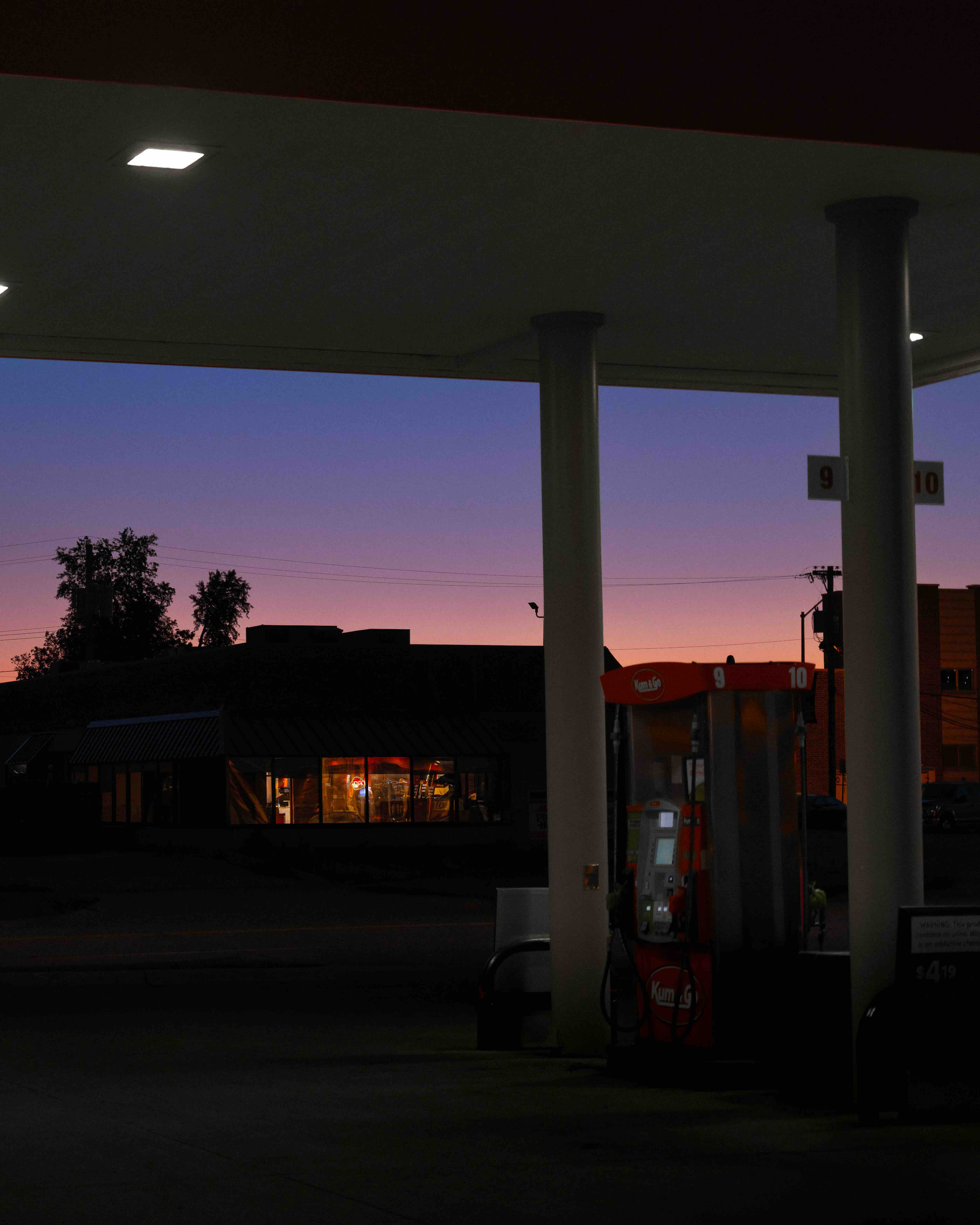 Photo of a gas station at sunset